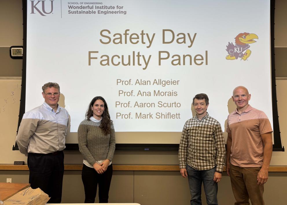 Prof. Aaron Scurto, Prof. Ana Morais, Prof Alan Allgeier, and Prof. Mark Shiflett in front of a screen with the words "Safety Day Faculty Panel"