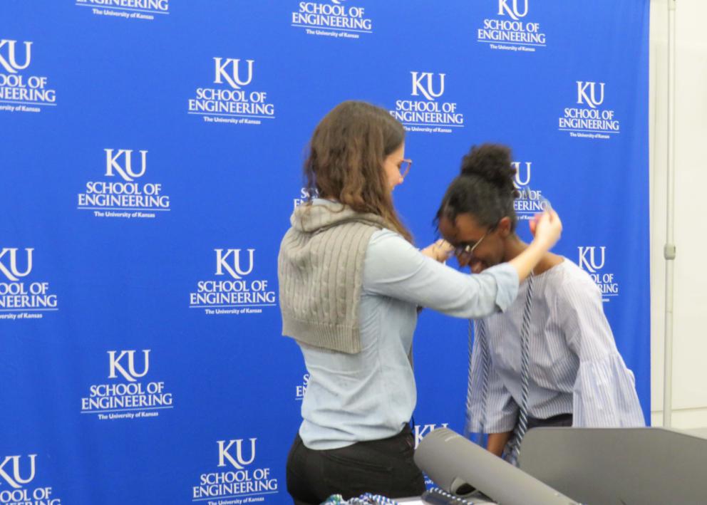 Dr. Ana Morais presents an award to Misgana Assefa