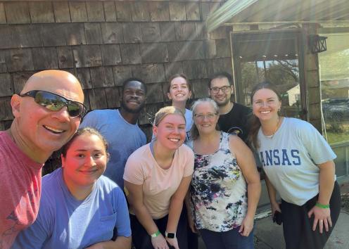 A group of people posing and smiling for a photo