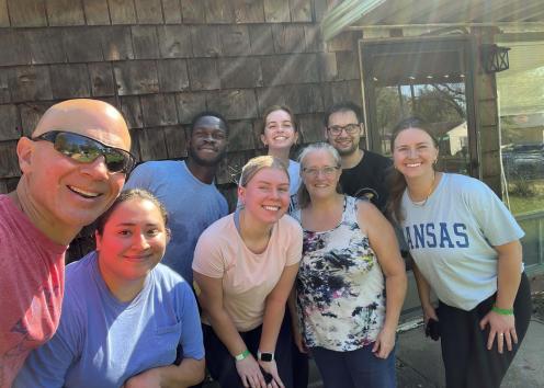 A group of people posing and smiling for a photo