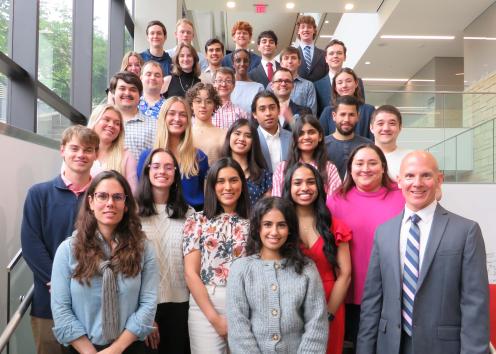 WISE undergrads and graduate students posing for a group photo on a staircase with Dr. Mark Shiflett and Dr. Ana Morais
