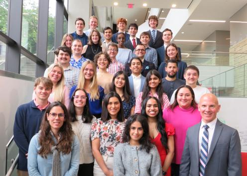 WISE undergrads and graduate students posing for a group photo on a staircase with Dr. Mark Shiflett and Dr. Ana Morais