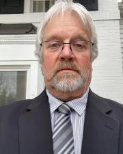 Bill in a suit taking a selfie